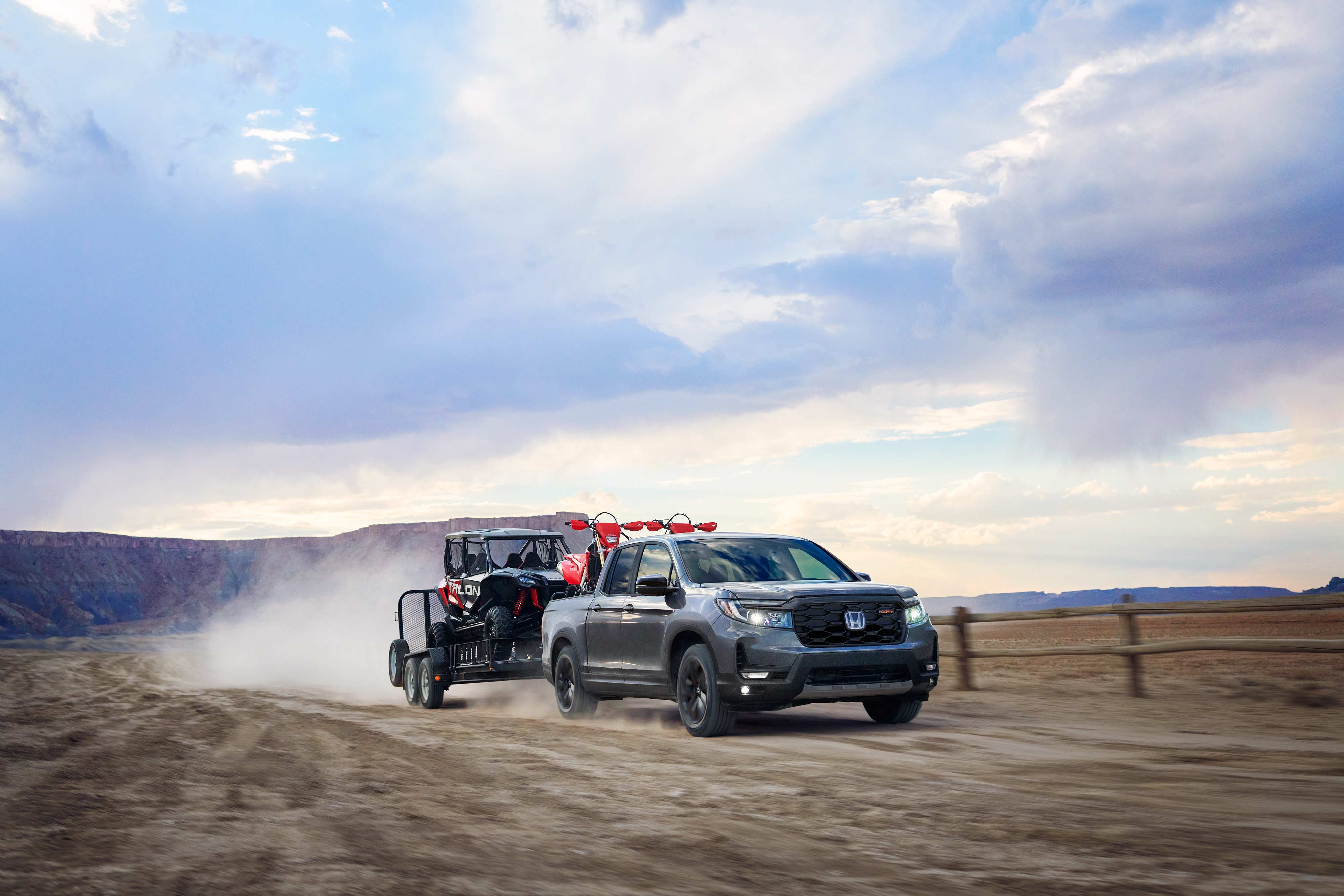 2027 Honda Ridgeline towing a cart off-road